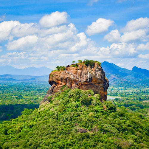 Sigiriya Lion Rock rising above green forest in Sri Lanka's Cultural Triangle