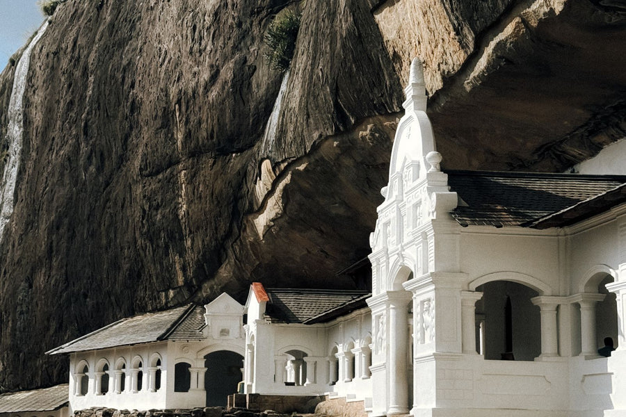 Dambulla cave temple nestled against dramatic rock formations, Sri Lanka