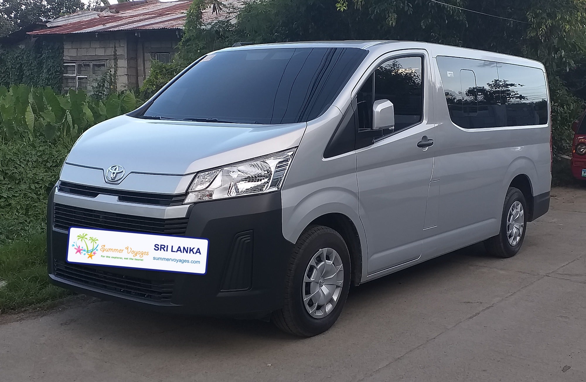 Toyota HiAce commuter van with Summer Voyages branded plate, representative image (base photo: Captainmorlypogi1959, CC BY-SA 4.0, Wikimedia Commons, modified)